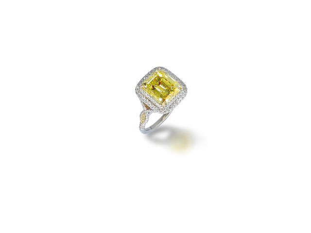 A coloured diamond and diamond ring