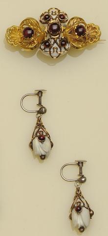 A matched garnet and ivory brooch and earpendants suite (3)