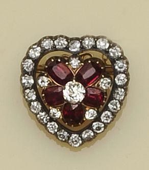 A Victorian diamond and ruby heart pendant/brooch