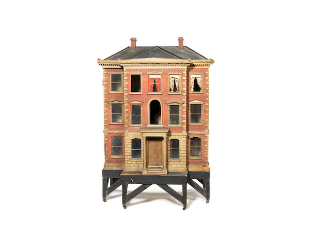 Large early painted red brick wooden dolls house on stand, English circa 1840