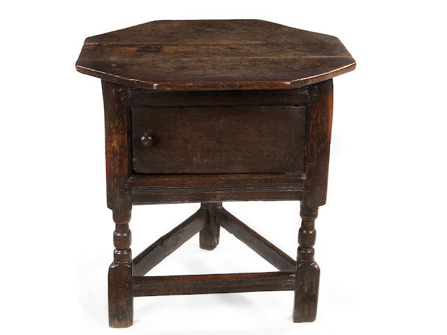 A rare Charles I oak joined triangular table/cupboard Circa 1640