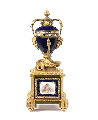 A late 19th century French porcelain mounted ormolu cercle tournant clock