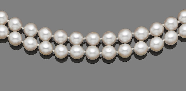 A double-stand cultured pearl necklace with ruby and diamond clasp