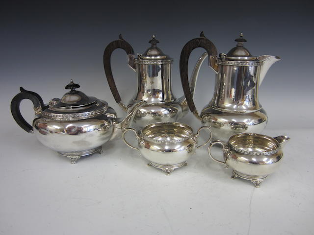 A silver five piece tea service, London 1935, coffee pot and hot water jug unmarked stamped silver,  (5)