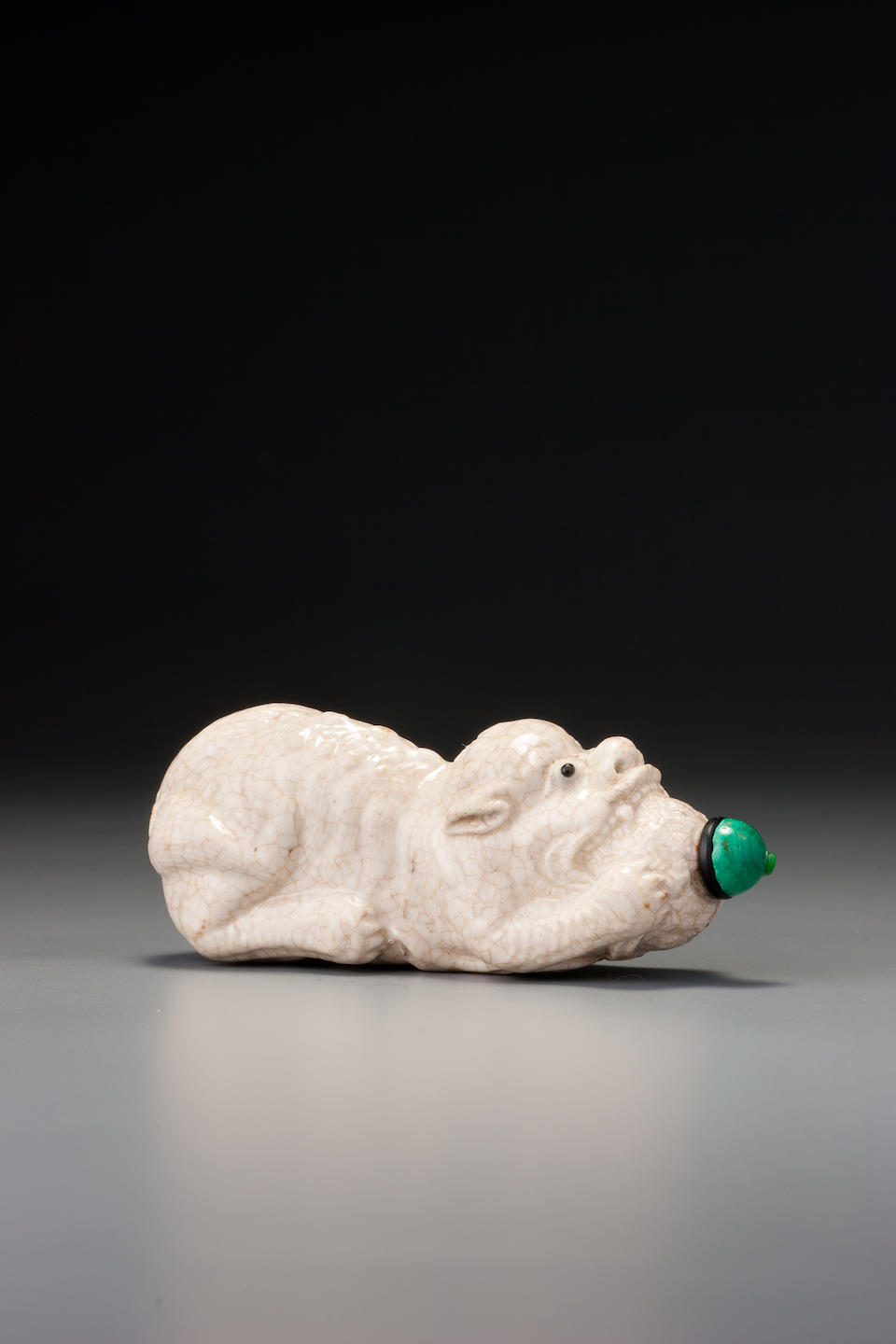 A crackled-glaze porcelain 'lion' snuff bottle Probably Imperial, Jingdezhen, 1796&#8211;1820