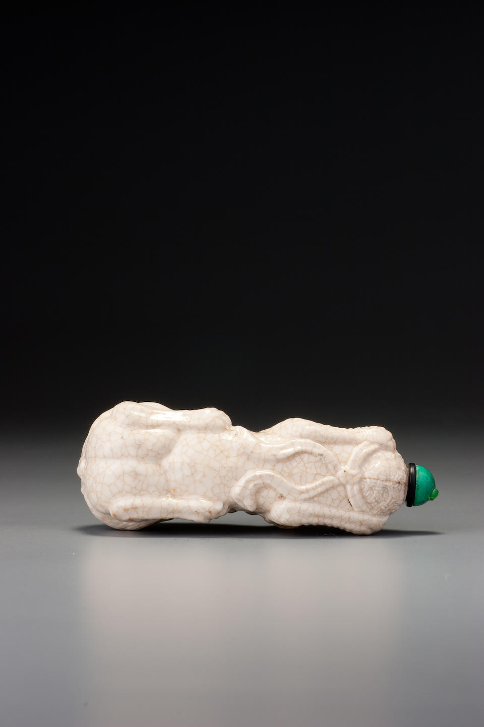 A crackled-glaze porcelain 'lion' snuff bottle Probably Imperial, Jingdezhen, 1796&#8211;1820