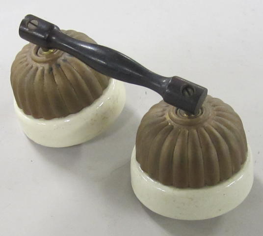 A pair of Edwardian jelly mould light switches,