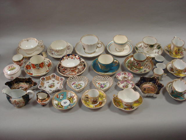 A small collection of cabinet cups and saucers, coffee cans and tea bowls,
