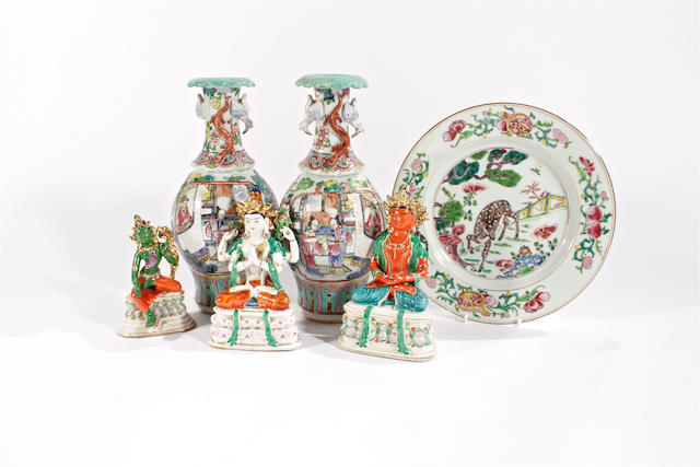 A pair of famille rose vases, a famille rose plate and three porcelain deities