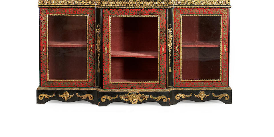 A French late 19th century gilt metal mounted ebony and ebonised, stained tortoiseshell and brass 'Boulle' marquetry breakfront bookcase