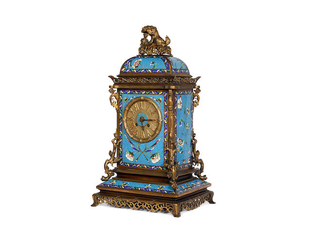 A French ormolu and champleve enamel mantel clock, 2nd half 19th Century, in the chinoiserie taste, decorated with flowering branches, on a bleu celeste ground, the arched top rectangular case surmounted by a kylin, the 8 day Japy Freres movement striking on a bell, numbered 18595 and stamped 'Miller & Sons', 50cm high.