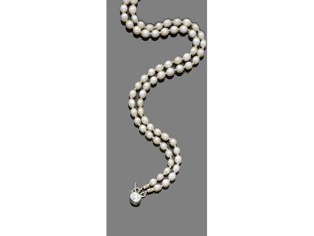 A double strand pearl necklace and diamond clasp