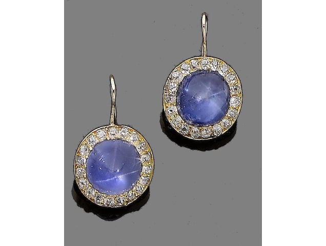 A pair of star sapphire and diamond earrings