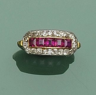 A ruby and diamond panel ring