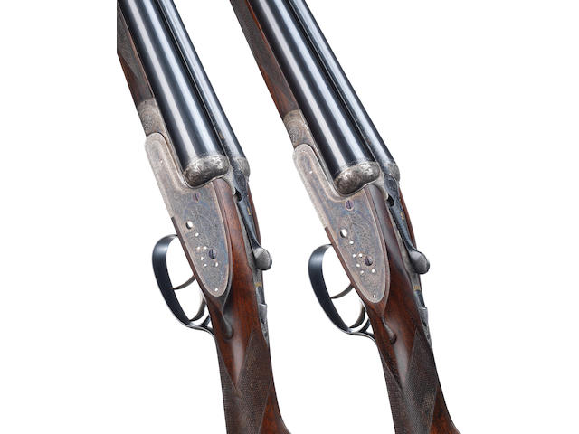 A fine pair of 12-bore 'Best Quality' sidelock ejector guns by William Powell & Son, no. 14077/8 In their brass-mounted leather case with canvas cover