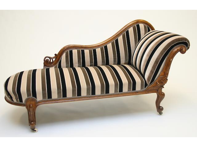 A Victorian walnut framed chaise longue