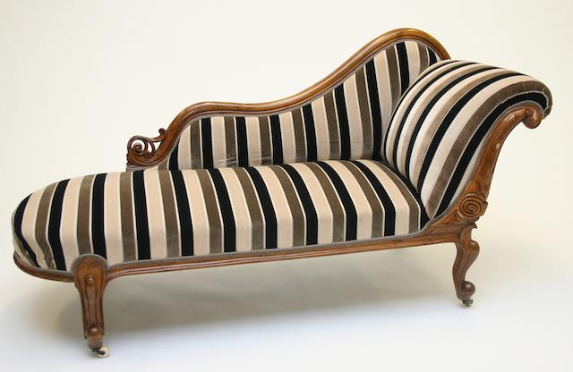 A Victorian walnut framed chaise longue