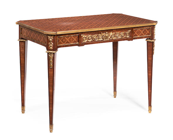 A French late 19th/early 20th century gilt metal mounted tulipwood and parquetry centre table in the Louis XVI style