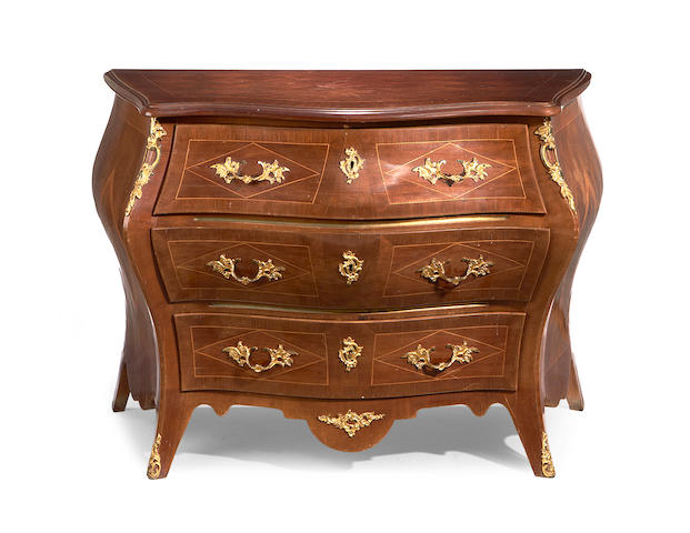 A Swedish late 19th/early 20th century gilt metal mounted mahogany bomb&#233; serpentine commode in the Louis XV style