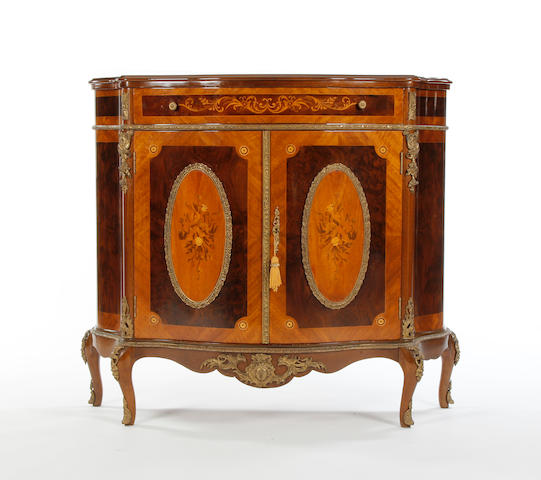 A mahogany and marquetry serpentine fronted chiffonier