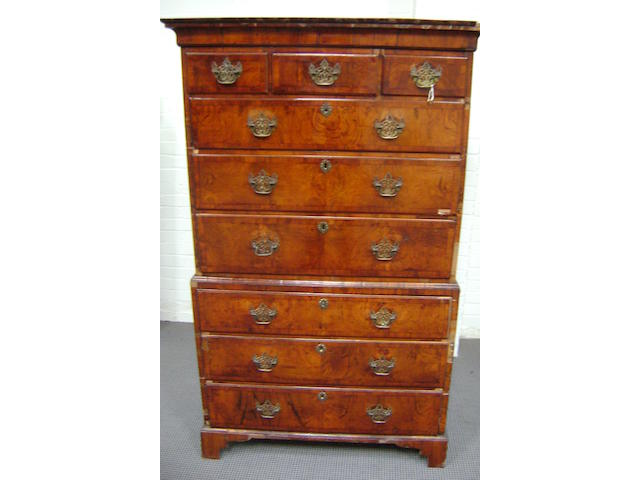 A George I Walnut tallboy with Cavetto cornice about three short and six long graduated drawers, 105cm wide, 171cm high