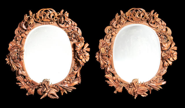 A pair of German late 19th century walnut mirrors