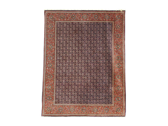 A part silk Tabriz carpet, North West Persia, 376cm x 298cm, signed