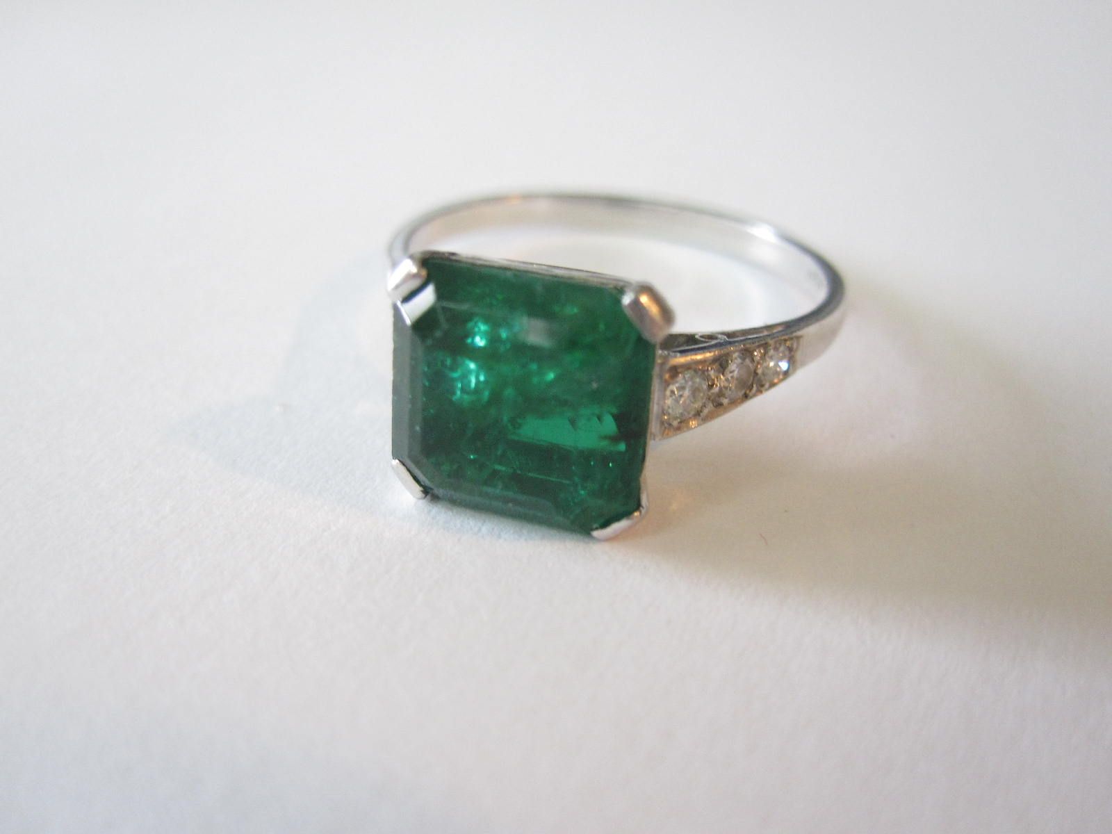 An emerald single-stone ring
