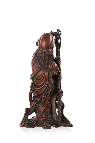 A Chinese wood carving of the deity Shou, 19th century