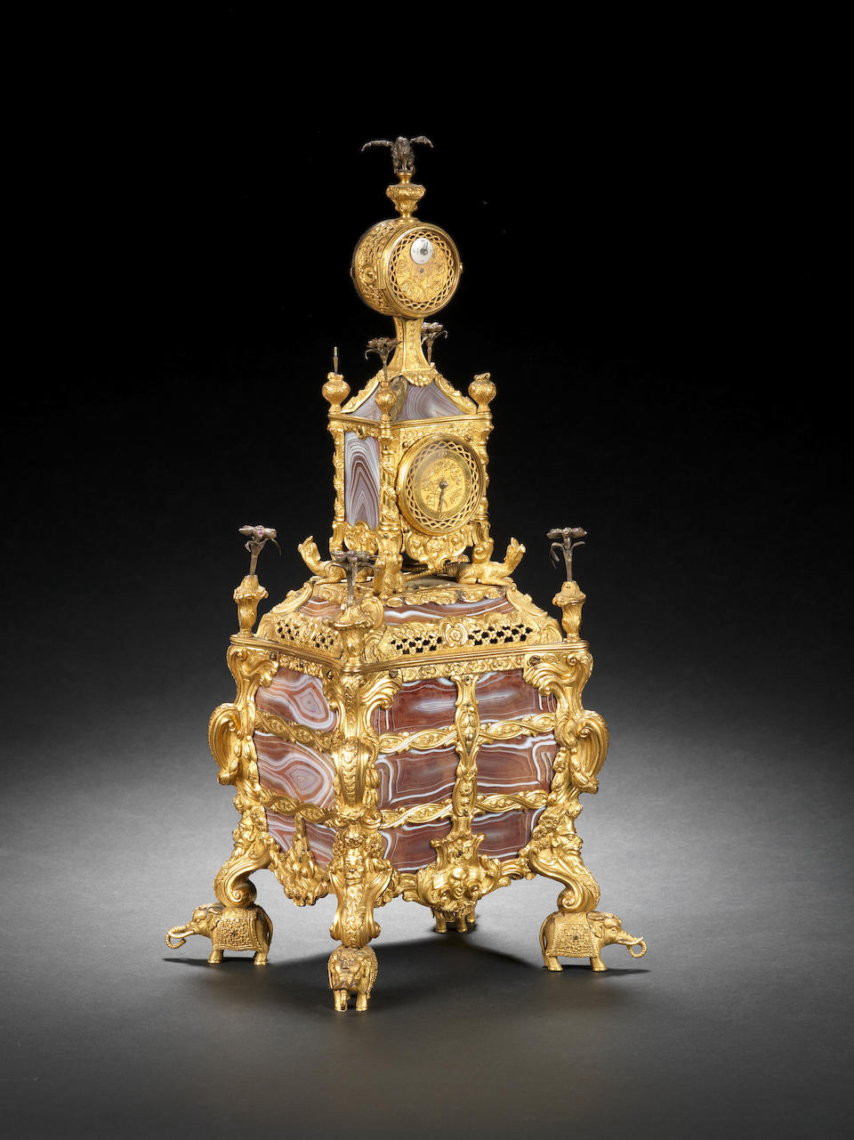 An exceptional mid 18th century agate-panelled and silver-mounted musical ormolu table clock with moonphase indication. Sold with the original key, signed and dated key, James Cox, London, 1766. James Cox, London 2