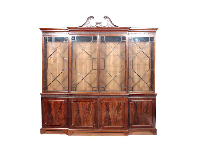 A late 19th century mahogany break-front bookcase Of George III design