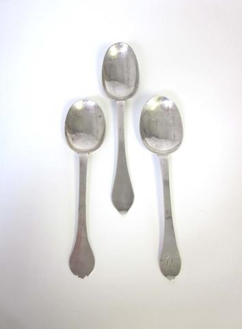 Two  silver trefid spoons marks rubbed, one possibly by Jonathan Bradley, London, date letter rubbed, the second maker's mark barely distinguishable, by John Ladyman, other marks worn smooth Sadler, London 1701 (3)