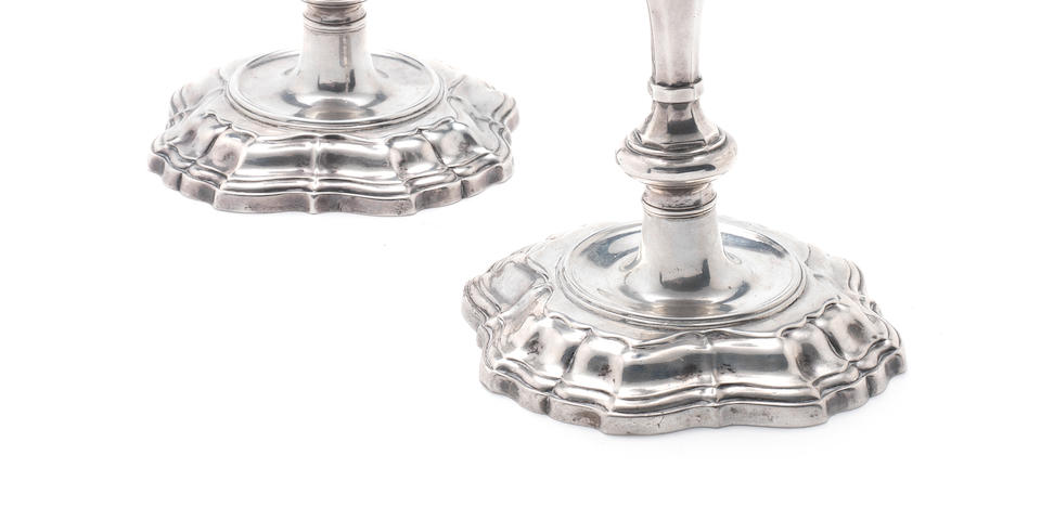 A pair of George II silver candlesticks maker's mark overstruck by date letter, one indistinguishable, the other possibly by Charles Hatfield, London 1736  (2)