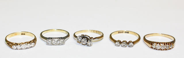 A collection of diamond set rings, (5)