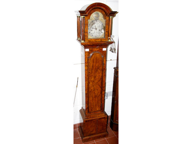 A walnut grandmother longcase clock,in 18th Century taste with arched hood and part sivlred dial inscribed Samuel Lea, London, 166cm high