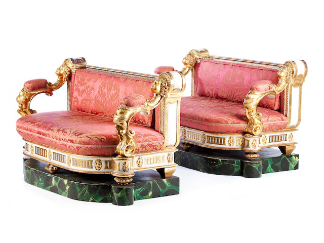 A pair of Italian mid-19th century giltwood and painted setteesIn the Baroque style