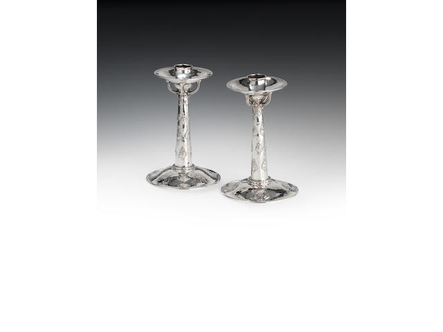 A pair of Arts & Crafts silver candlesticks by Omar Ramsden and Alwyn Carr, London 1914  (2)