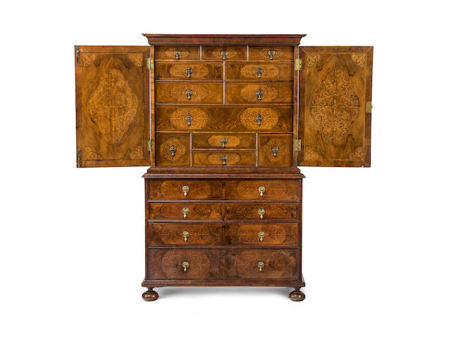 A William & Mary period  walnut and seaweed marquetry  cabinet on chestEnglish, late 17th century