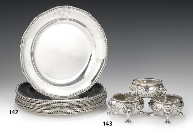 A suite of three George III silver salt cellars by William Burwash & Richard Sibley, London 1811  together with three salt spoons (6)