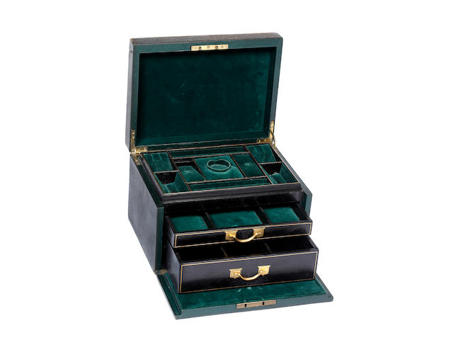 A large gilt tooled dark green leather jewellery box containing assorted jewellery