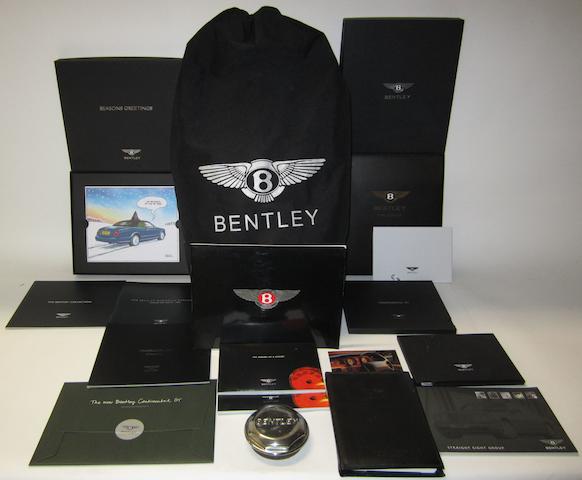Assorted Bentley publications and a Bentley Continental car cover,