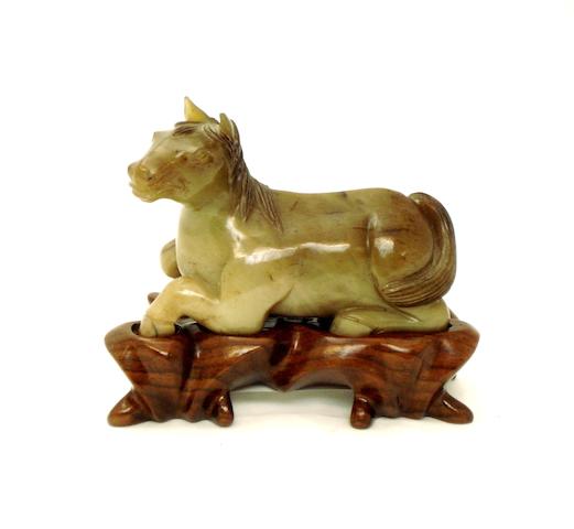 A Ming style jade horse 19th/20th century