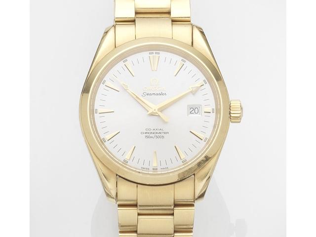 Omega. An 18ct gold automatic calendar bracelet watch with papersSeamaster Co-Axial, Ref:21033000, Case No.806******, Movement No.806*****, Sold 31st December 2005