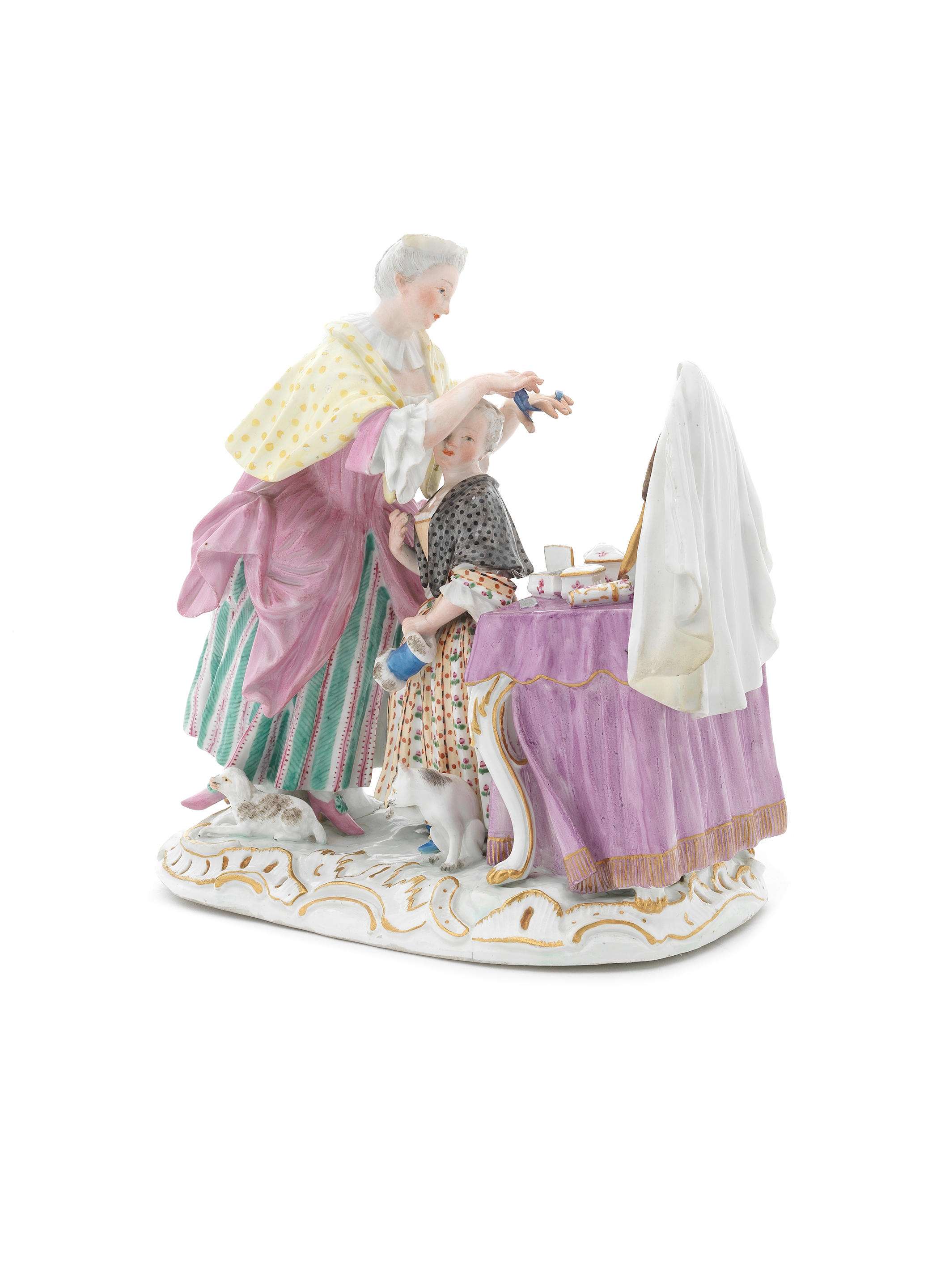 A Meissen group of a mother and child at a dressing table, circa 1764-73