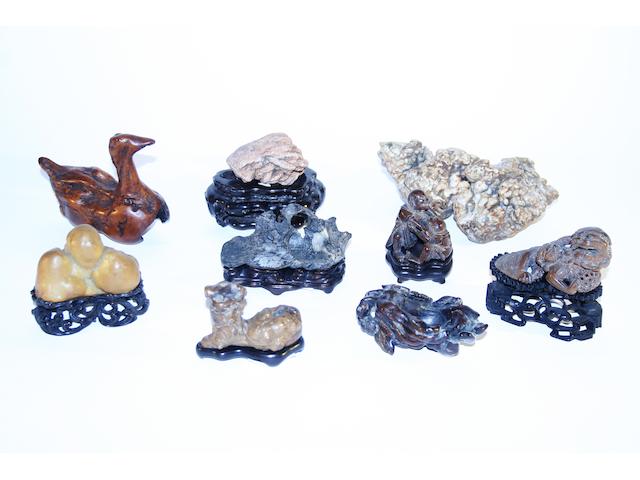 A collection of Chinese worked stone and wood carvings