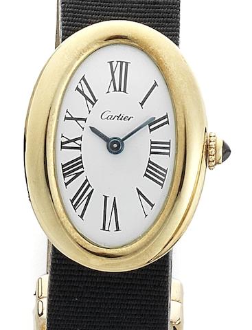 Bonhams : Cartier. A lady's 18ct gold manual wind oval ...