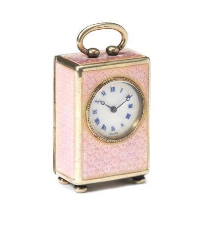 A good early 20th century silver and enamel decorated miniature boudoir timepiece Hallmarked for CG, London