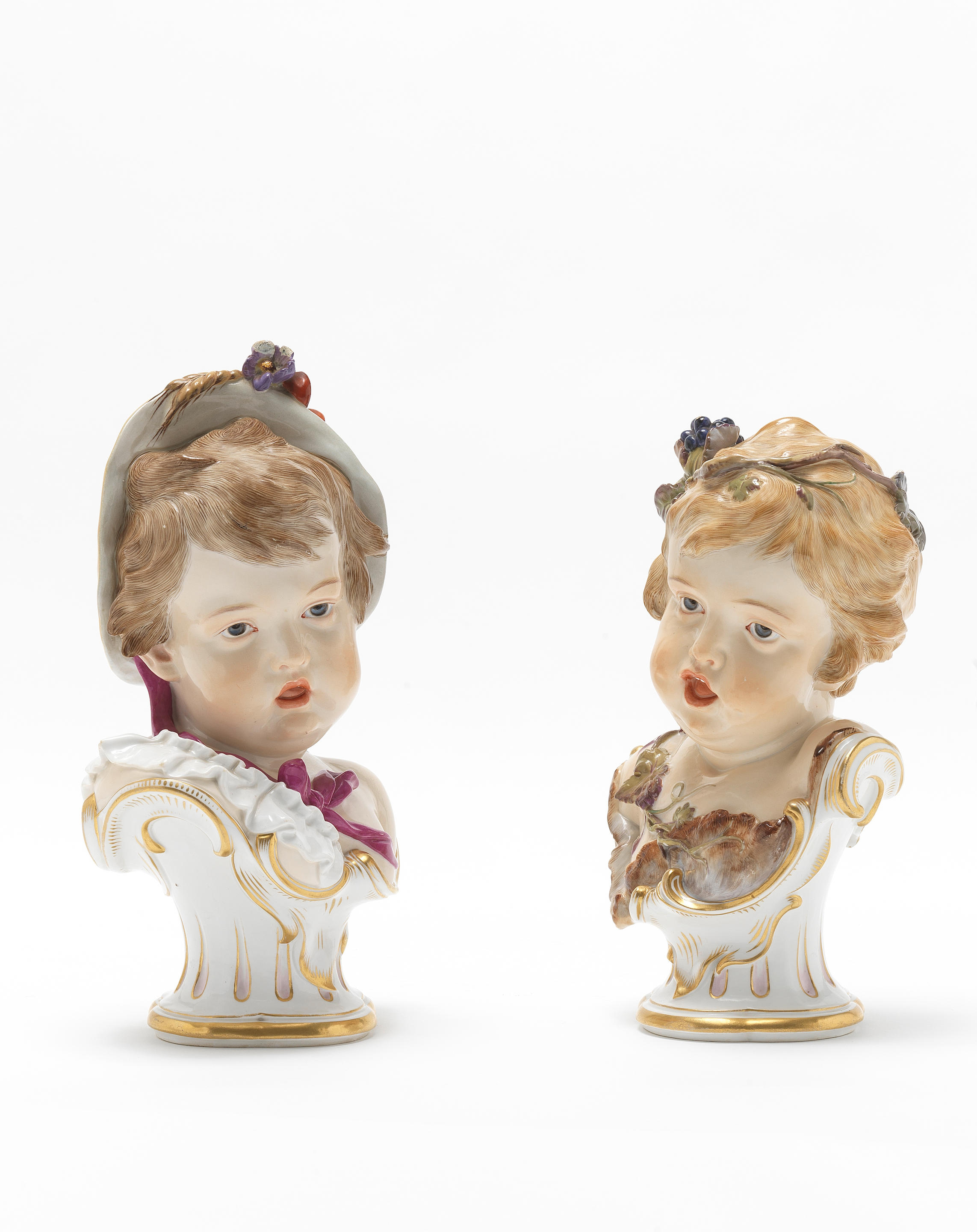 A pair of Meissen busts of children allegorical of the seasons, circa 1880