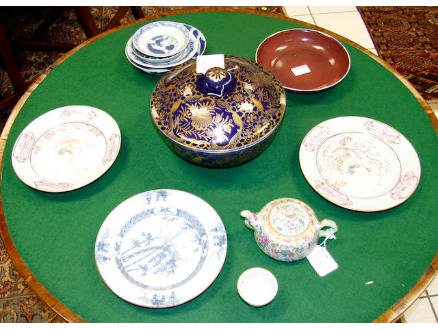 A Qianlong copper red dish,seal mark and of the period, 21cm diameter and a collection of chinese porcelain to include: a small famille rose cup, documentary inscription, Daoguang mark and period, four small saucer dishes, ming and later, a small famille rose enamelled tea pot and cover, 25cm diameter, a pair of plates and another (13)