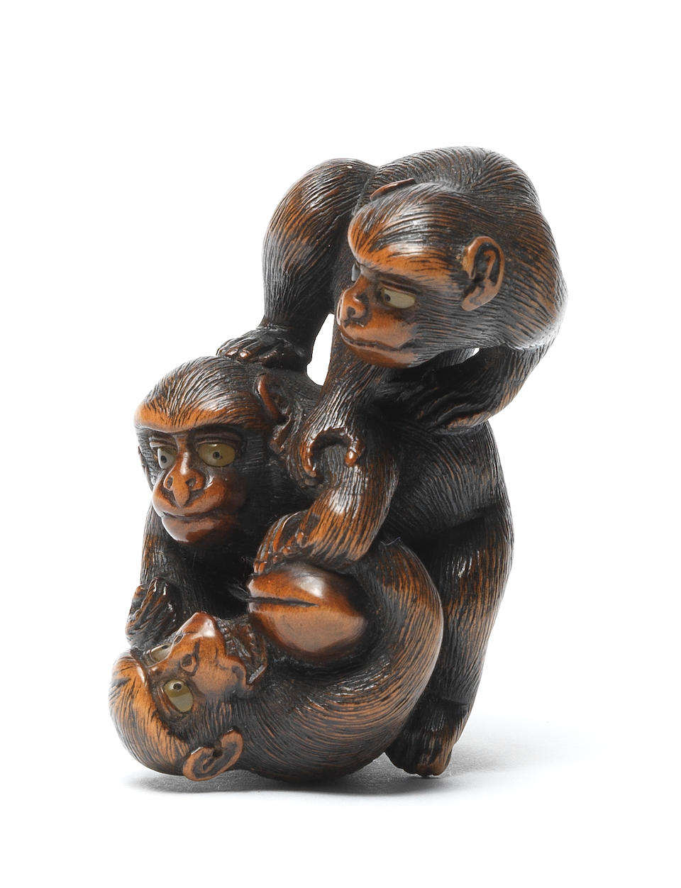 A fine wood netsuke of three monkeys By Naito Toyomasa (1773-1856), Tanba, early 19th century